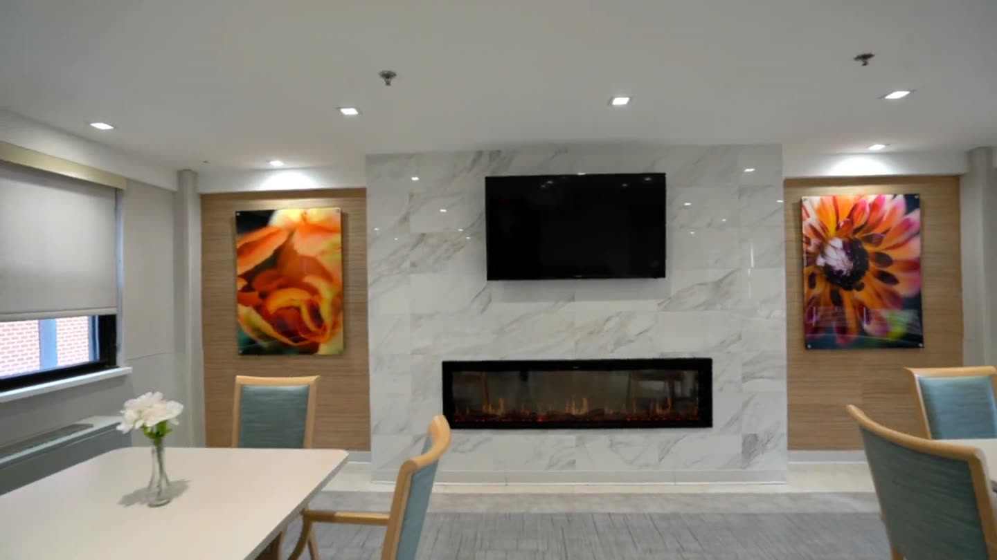 The renovated lobby at Golden Gate, with a fireplace and armchairs